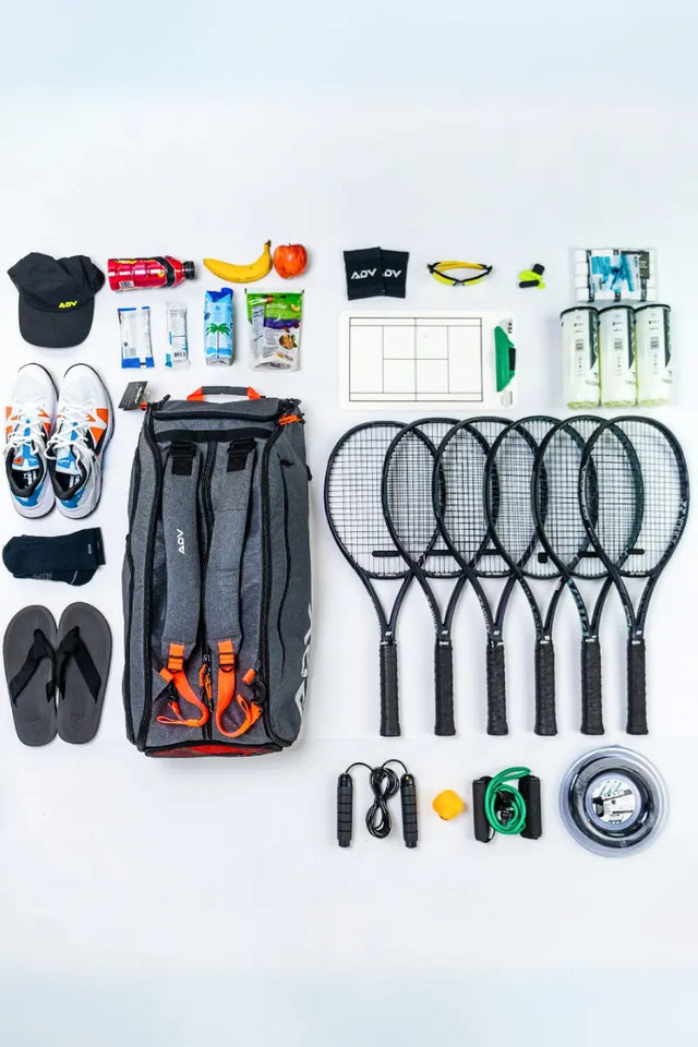 best tennis gear neatly organized, including rackets, shoes, apparel, and accessories, alongside a premium ADV tennis bag