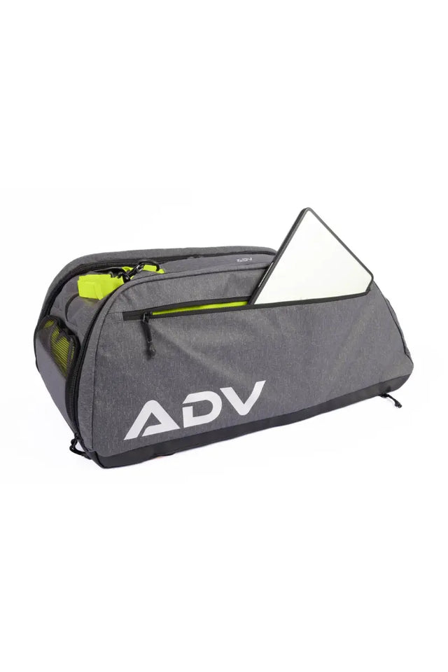 Multi-sport gear bag with spacious compartments holding a laptop and accessories, branded with large ADV logo