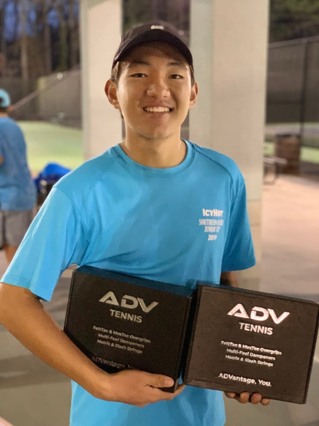 Tennis accessories including ADV Tennis overgrip and string kits held by a smiling player in a blue shirt.