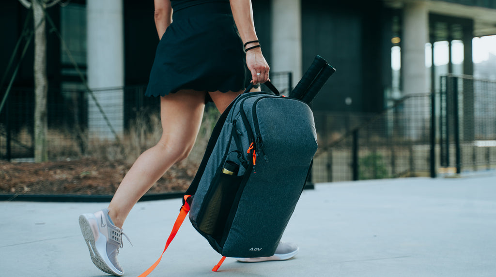 payer with adv tennis backpack