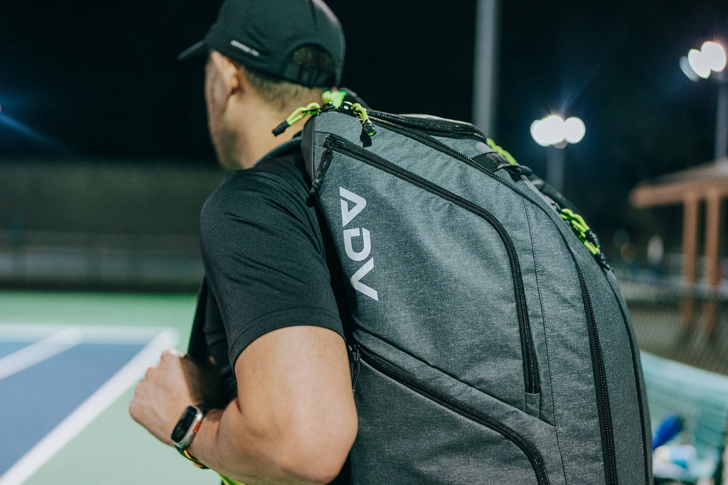 payer with adv tennis backpack